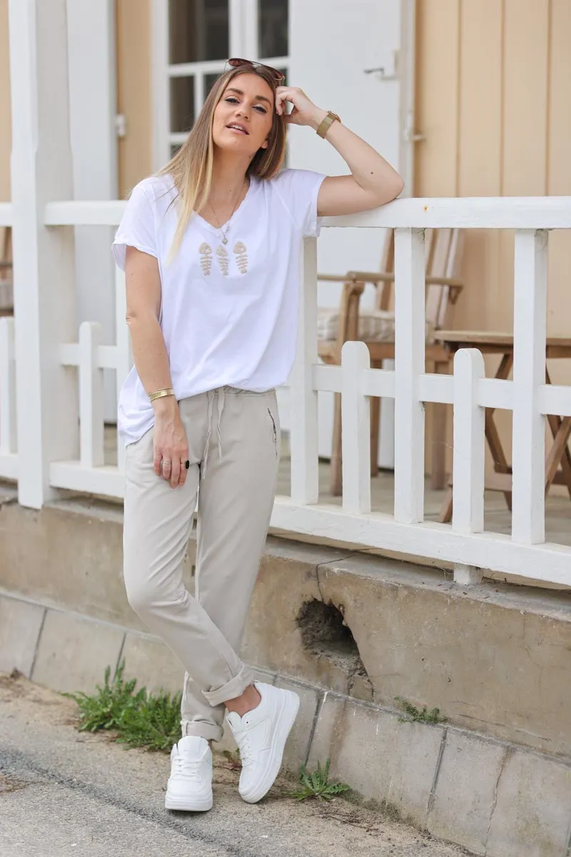 Jogging confort beige ceinture élastique liseré brillant sur les cotés